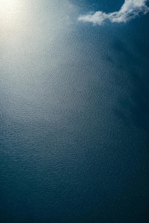 the ocean with water spraying up lots of small bubbles