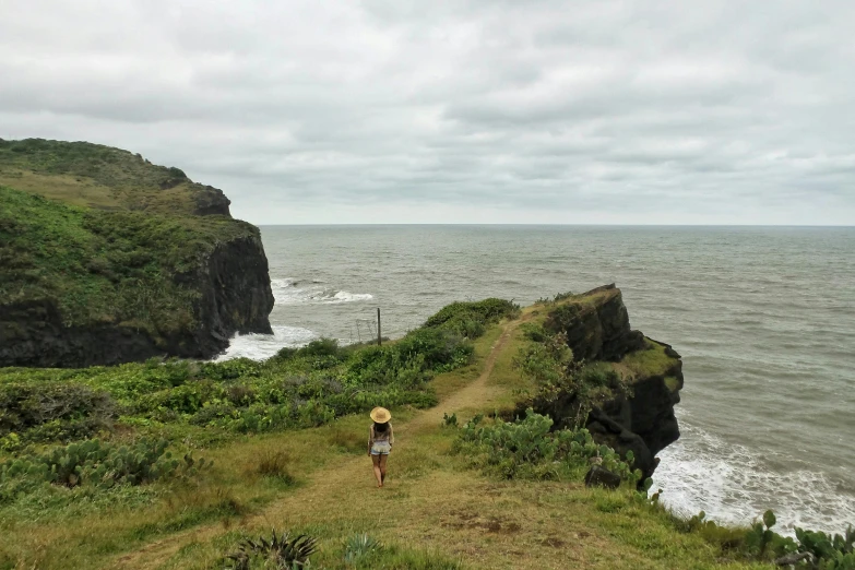 there is a person that is walking by the water