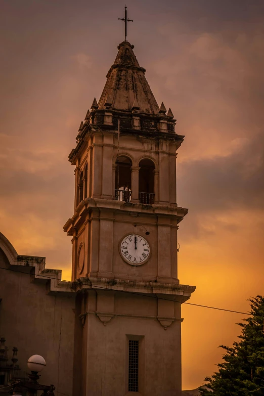 a very tall tower with a clock on it's side