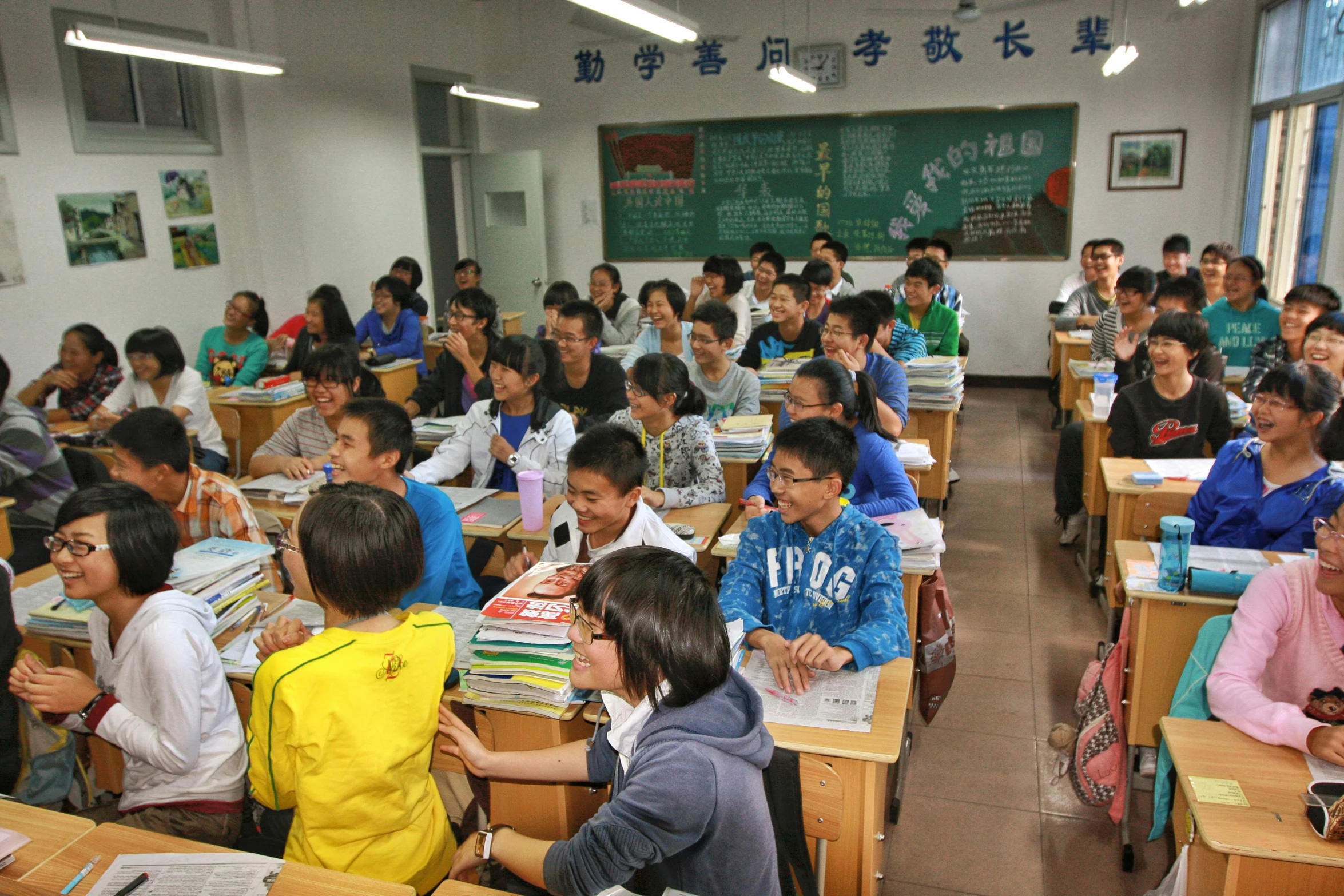 a classroom filled with students doing tasks on their homework