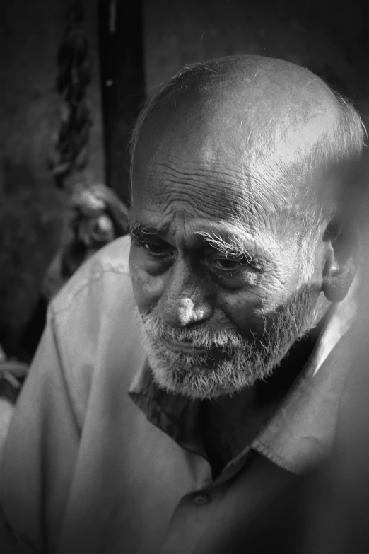 a black and white po of a man's face