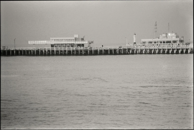 a pier in the middle of a large body of water