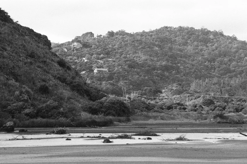 a river flows through a valley surrounded by mountains