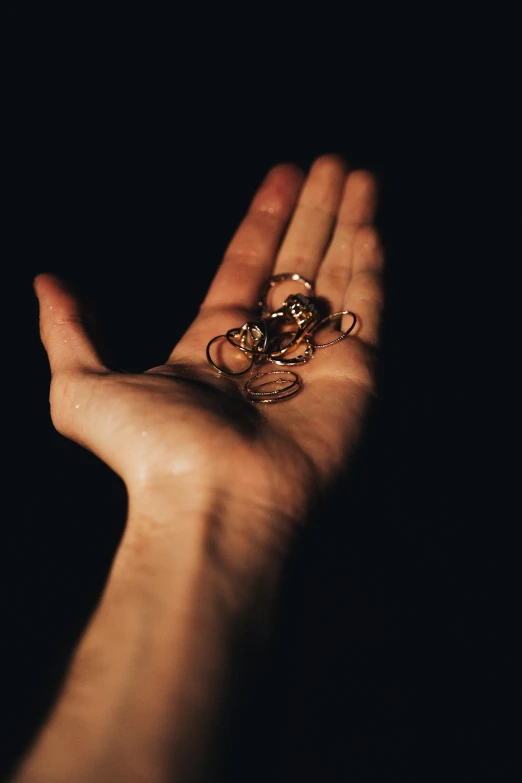an image of a hand that has two rings on it