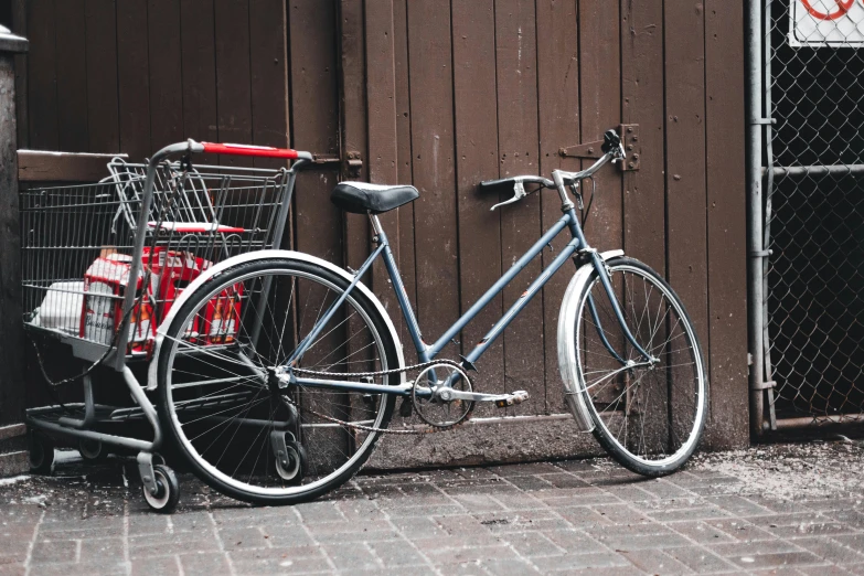 a bicycle is parked next to the wall of a building