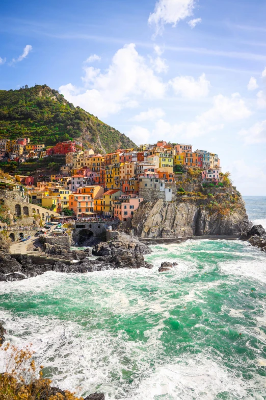 a scenic view of the coast next to a village