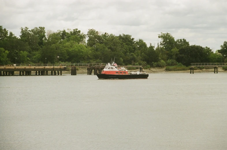 a barge on the river is coming down the water