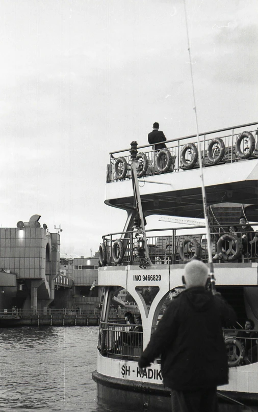 a man that is standing next to a boat