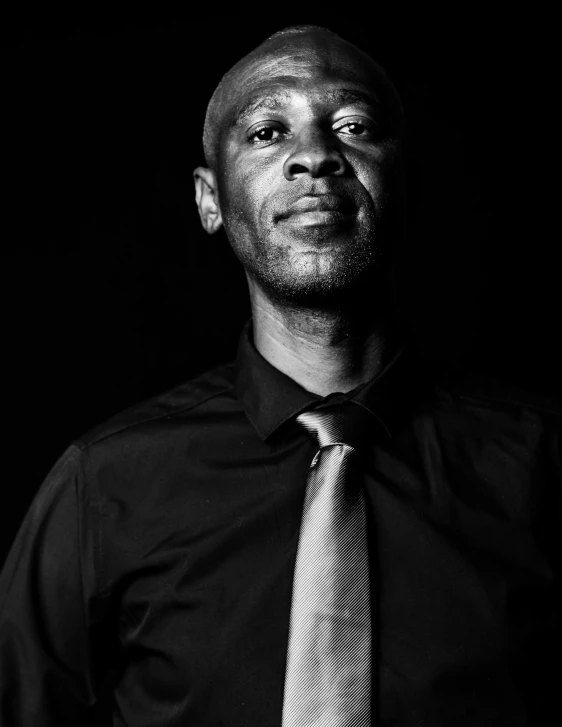 man wearing a dark shirt and a neck tie