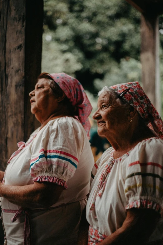 two women in mexican clothing stand together