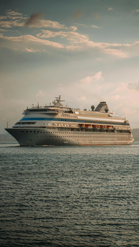 a large cruise ship is sailing out in the water