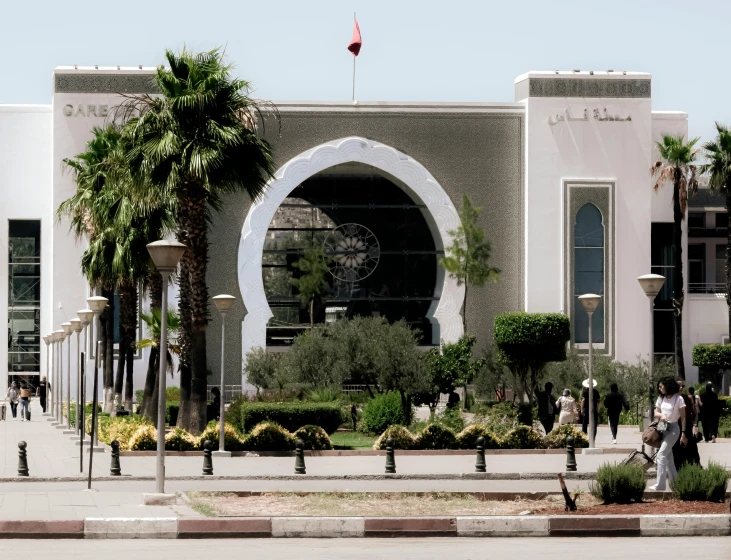 an elaborate building on the side of a road