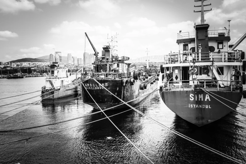 some boats that are docked together in the water