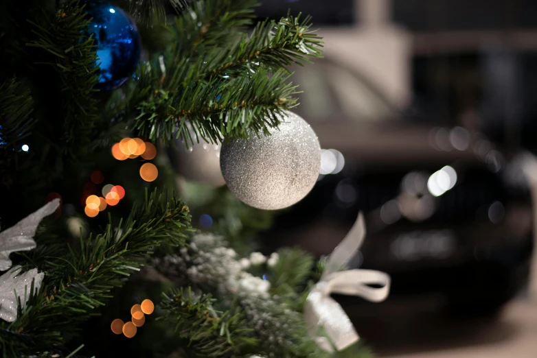 an ornament is hanging from the christmas tree