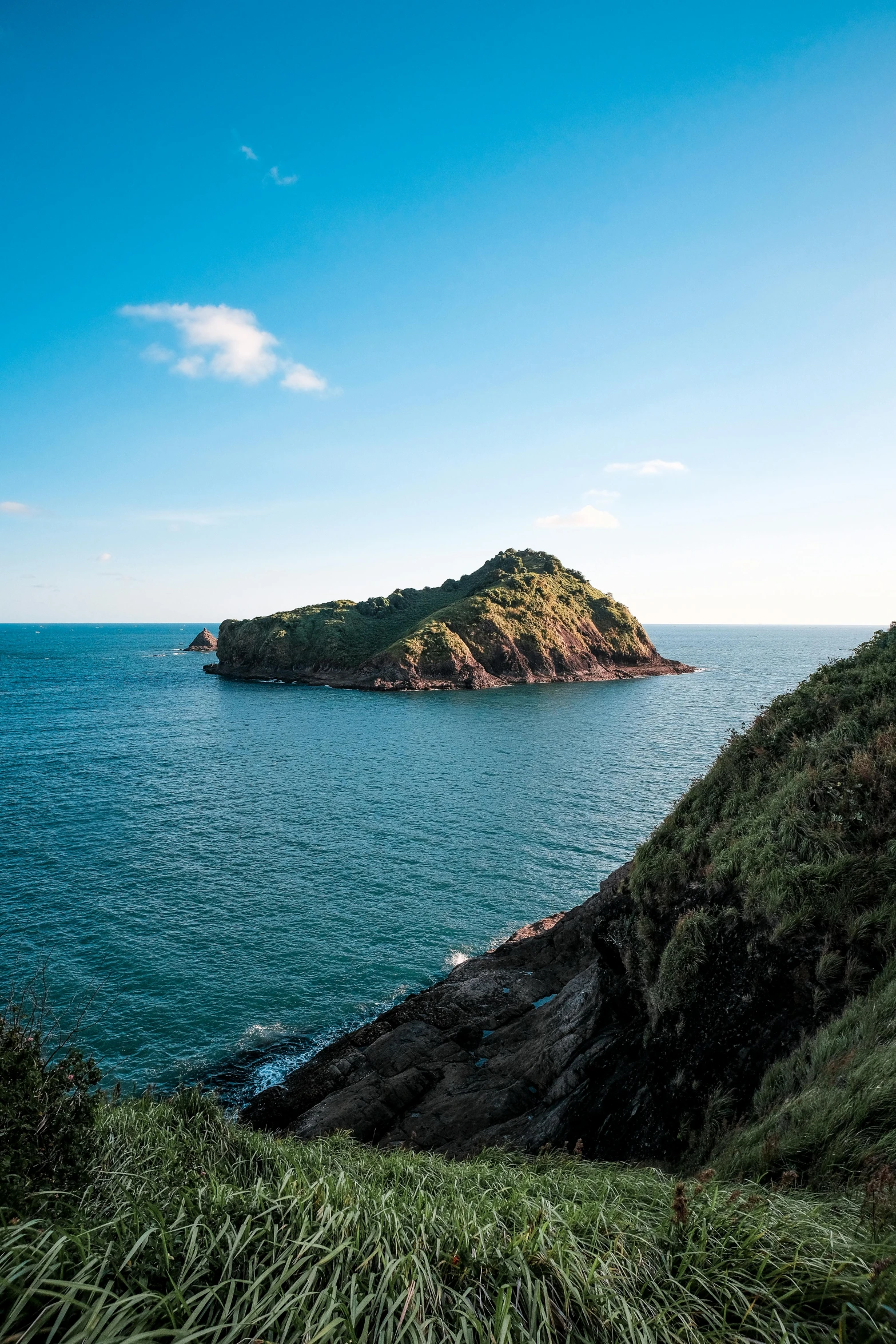 an island on a hill near the ocean