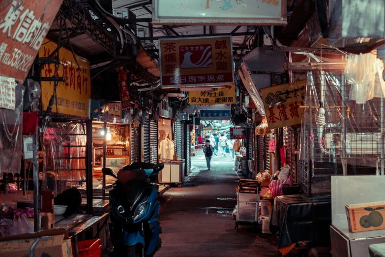 a narrow walkway that has signs over it