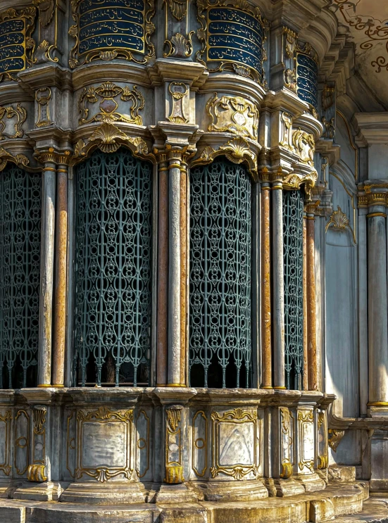 the interior of a building with a window and gilded decoration