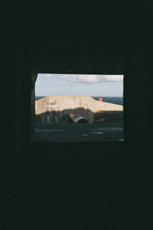 a view out of the tunnel at the mountains