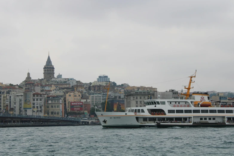 a large white cruise ship in the water