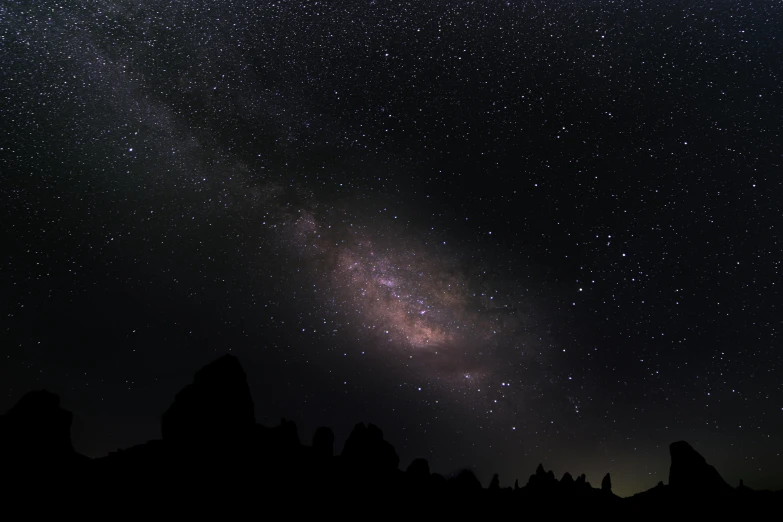 the milky is visible in the distance as seen from mountains