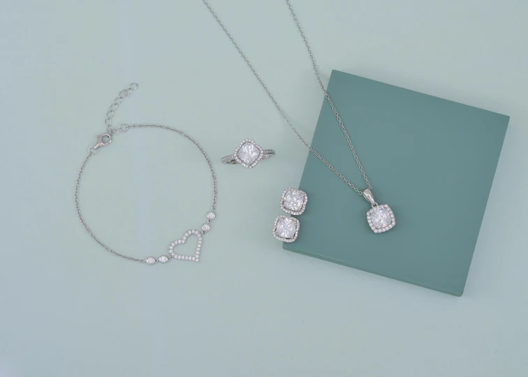 two different kinds of jewelry are placed on the table