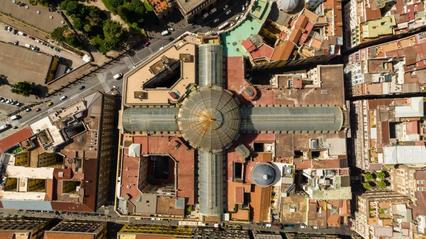 an aerial view of a large building in the middle of a city