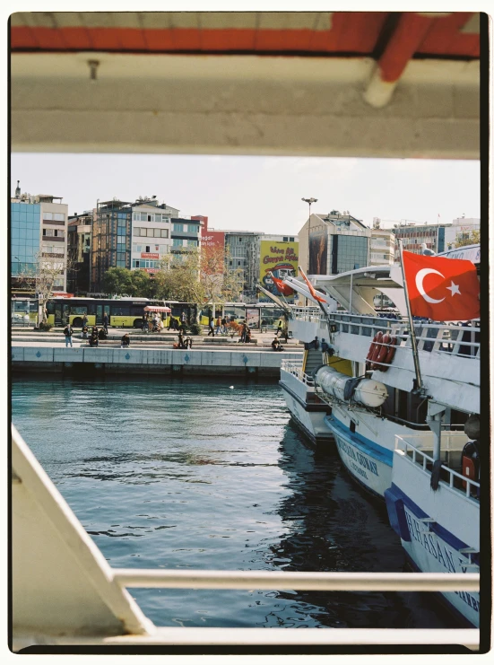 boats parked in the harbor next to the city