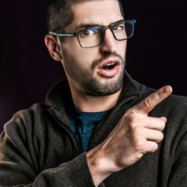 a man wearing glasses gives the finger sign