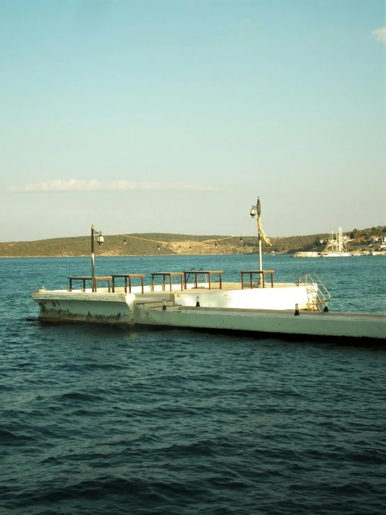 a white boat sitting on top of the water