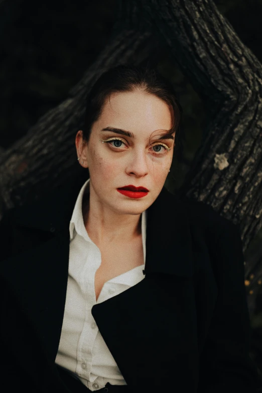 a woman in black and white with red lips