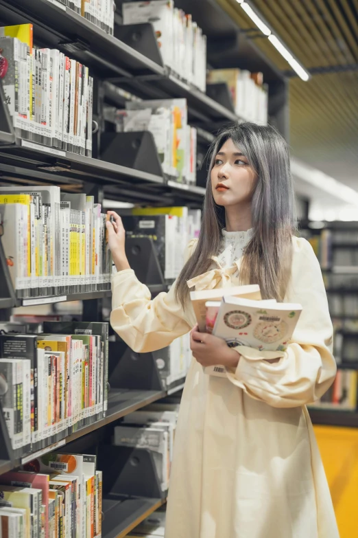 a woman looking at a shelf of dvd's