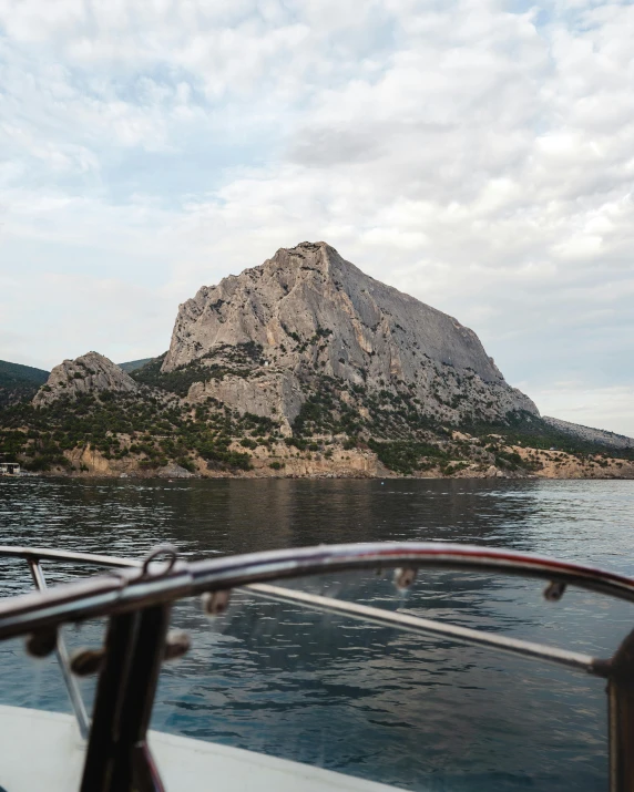 an island and rock outcropping in the sea