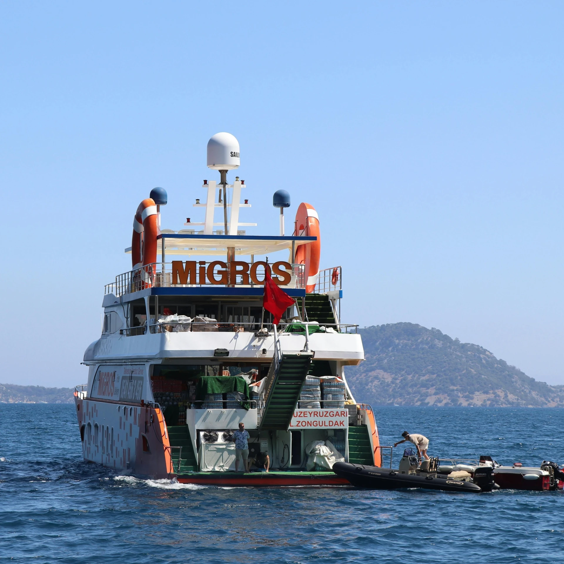 a boat that is in the water with some people on it