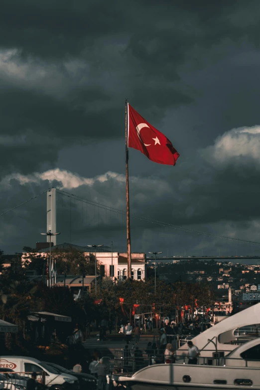 a flag waving on the top of a boat