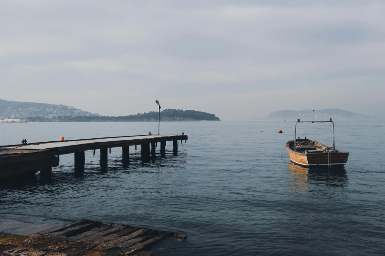 a small boat in the middle of water