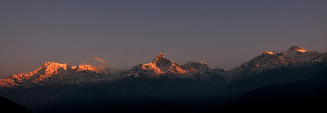 a beautiful view of the rocky mountains with snow on them