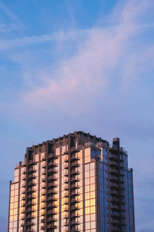 a tall building with windows at the top of it