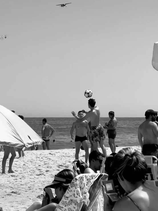 a group of people lounging on the beach