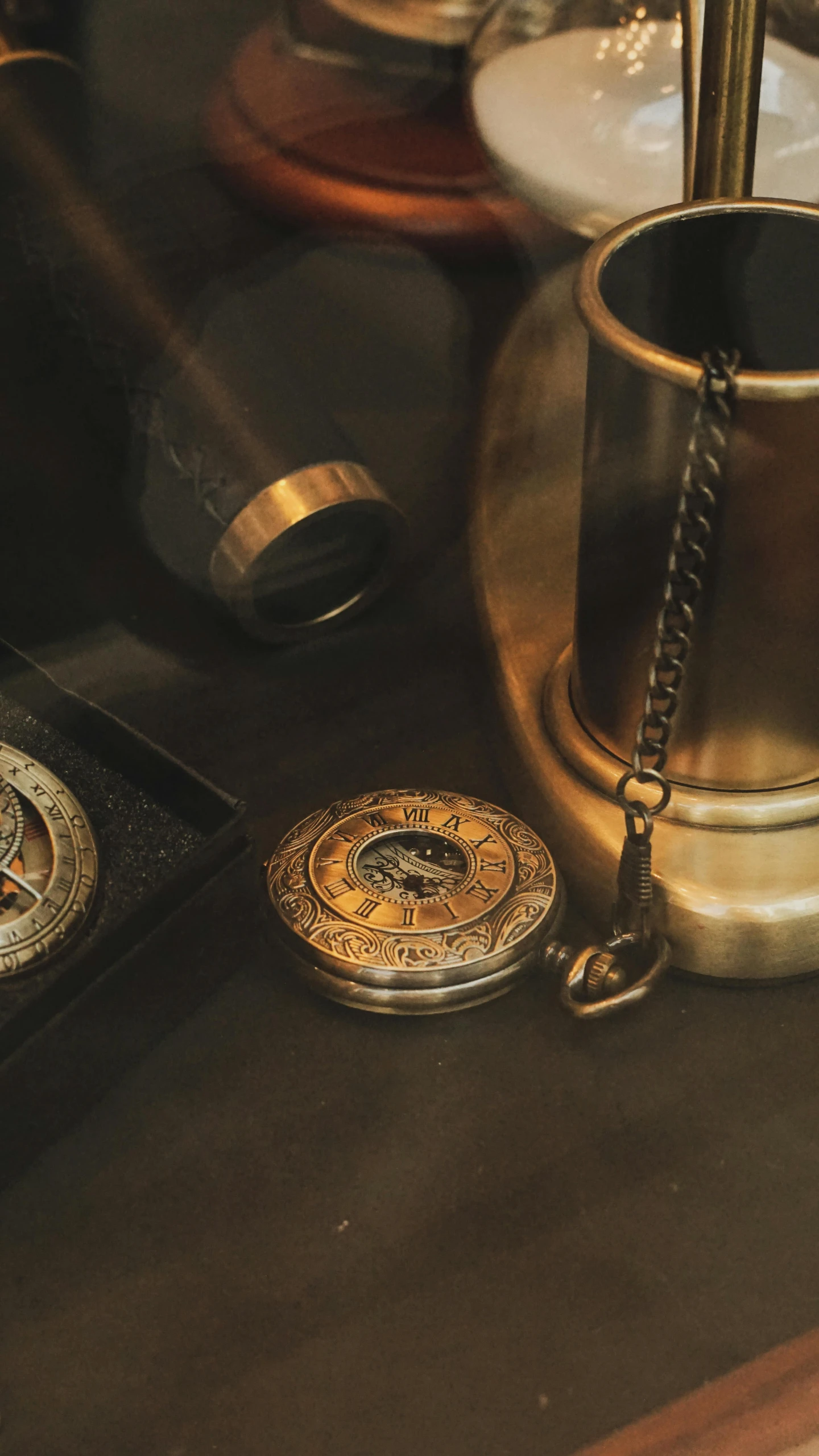 antique keys and a ss teapot in front of the coffee mug