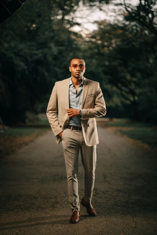 a man wearing a suit and sunglasses