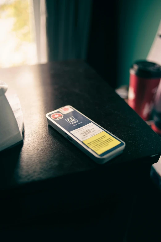 a cell phone that is next to a desk