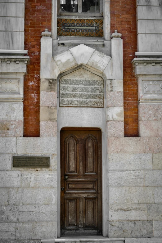 the front door to a old church with arched windows