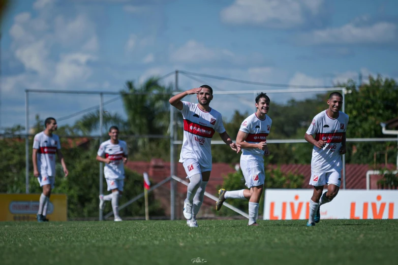 soccer players running to celete after a goal