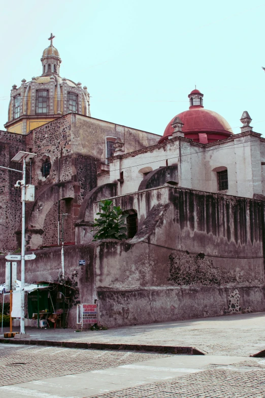 an old brick building in the center of a city