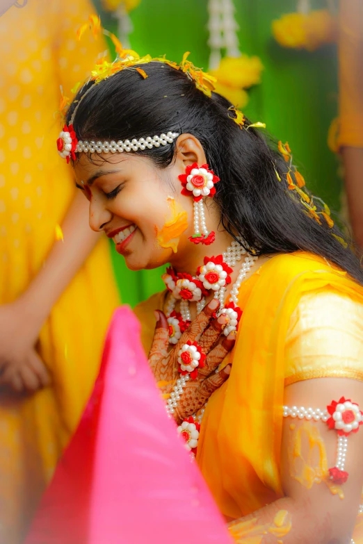 a young woman smiles in a colorful outfit