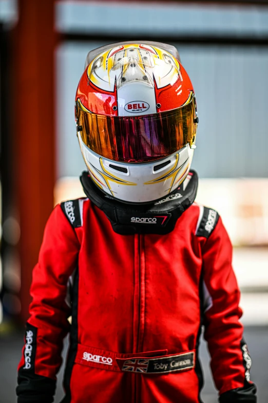 a  with a helmet standing on a road