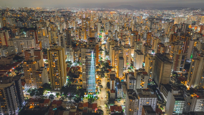 view of city buildings in an urban area at night