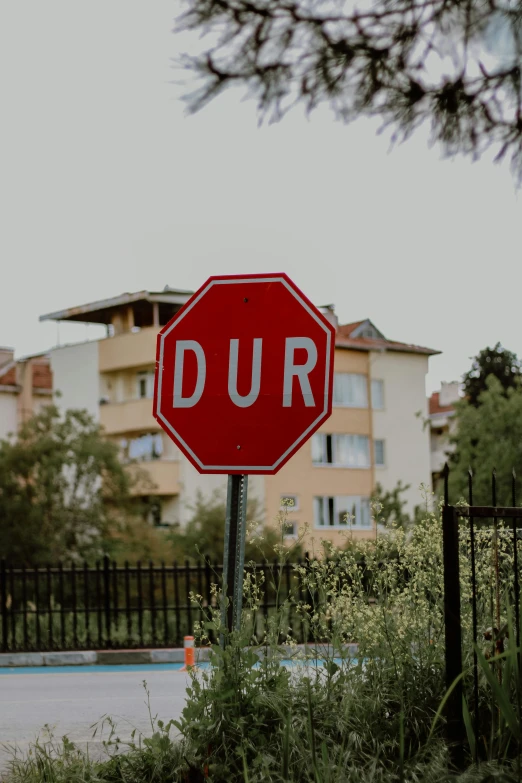 a stop sign has a small message underneath it