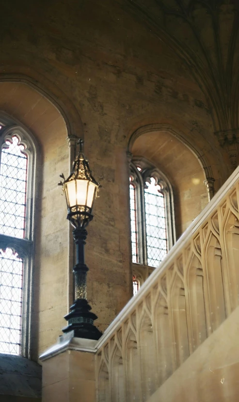 the stair has a lamp post and two windows