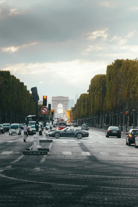 several cars parked along the side of a busy street